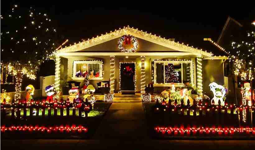 Festive house glowing with cheerful holiday lights