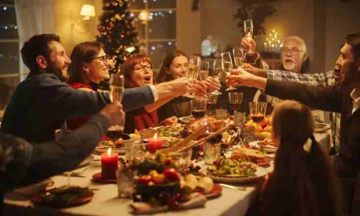 Family toasting dinner at celebrate christmas night